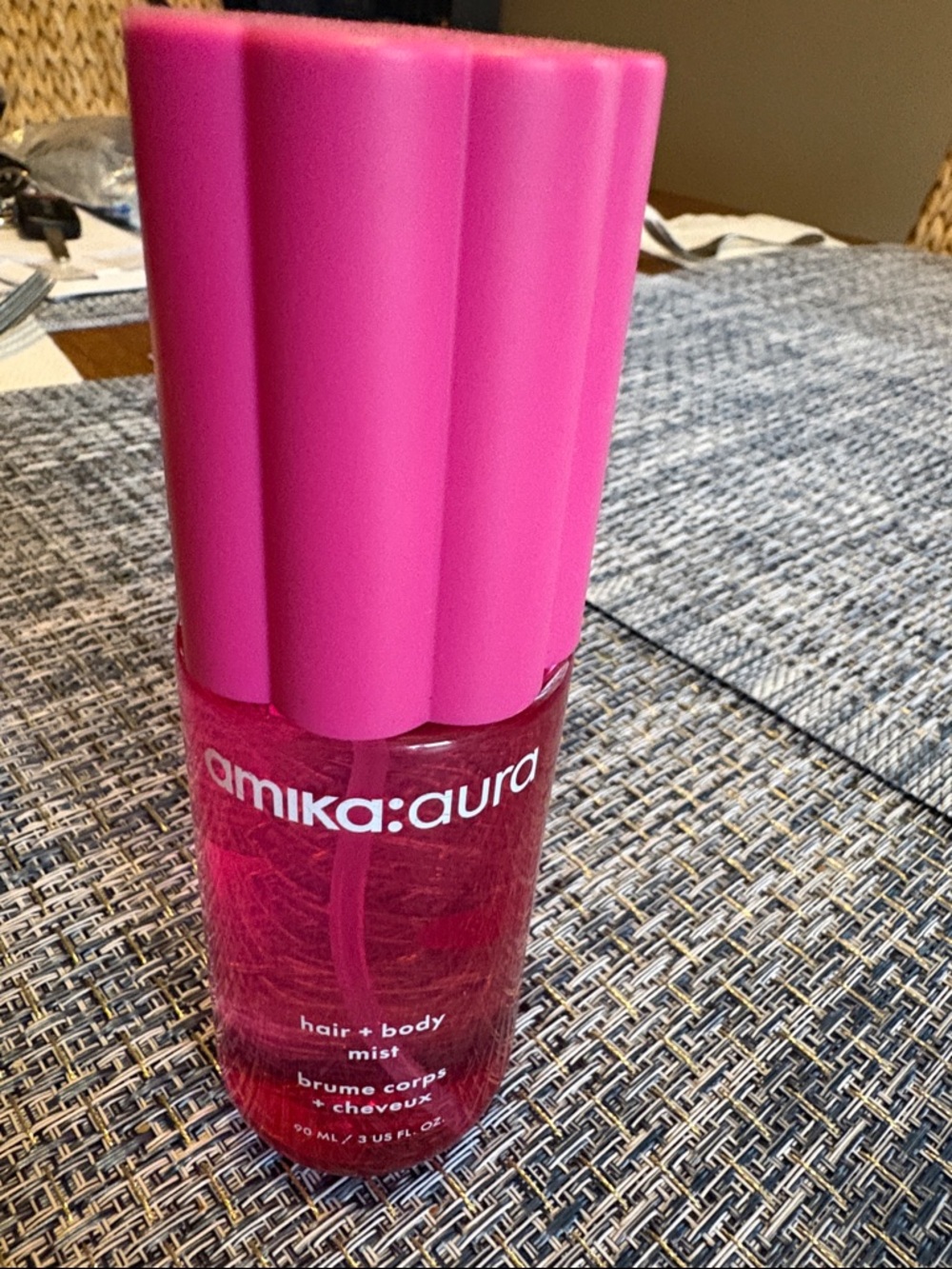 amika aura Hair + Body Mist in Bright Pink Bottle